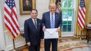 President Trump holds an a letter from North Korean leader Kim Jong Un, delivered to him by North Korean envoy Kim Yong Chol in the Oval Office on Friday. (Shealah Craighead/The White House)