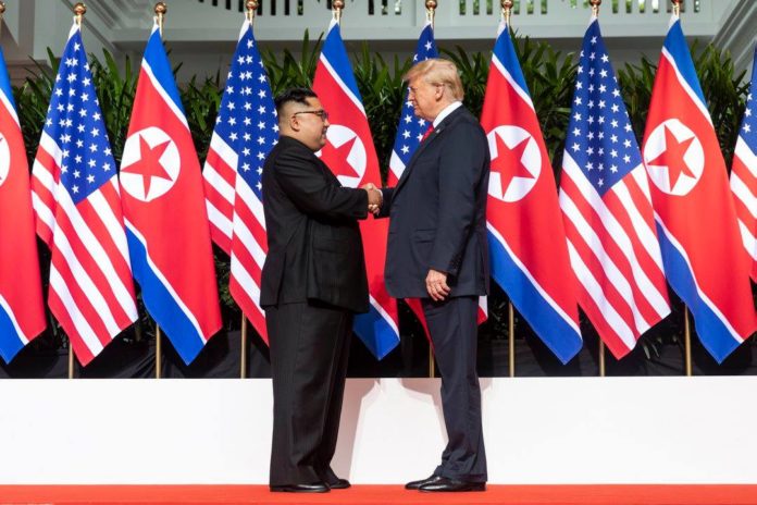 President Donald J. Trump and North Korean leader Kim Jong Un, shake hands as they meet for the first time, Tuesday, June 12, 2018, at the Capella Hotel in Singapore.