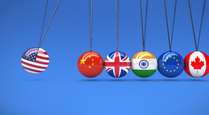 Global Relationships International Flags Cradle A depiction of national flags as balls colliding.