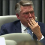 Congressional candidate displays emotion in ballot fraud hearing.